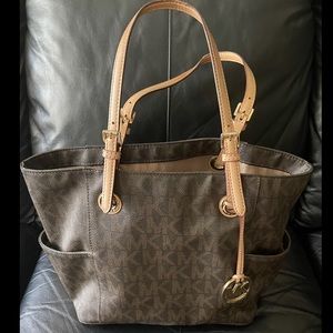 Michael Kors Tote. Used. Good condition. Some wear on handles- see photos.